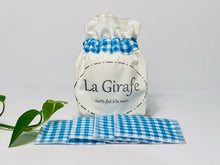 Load image into Gallery viewer, Ivory pouch printed with La Girafe Couture logo with a stack of Blue Checkered makeup remover pads

