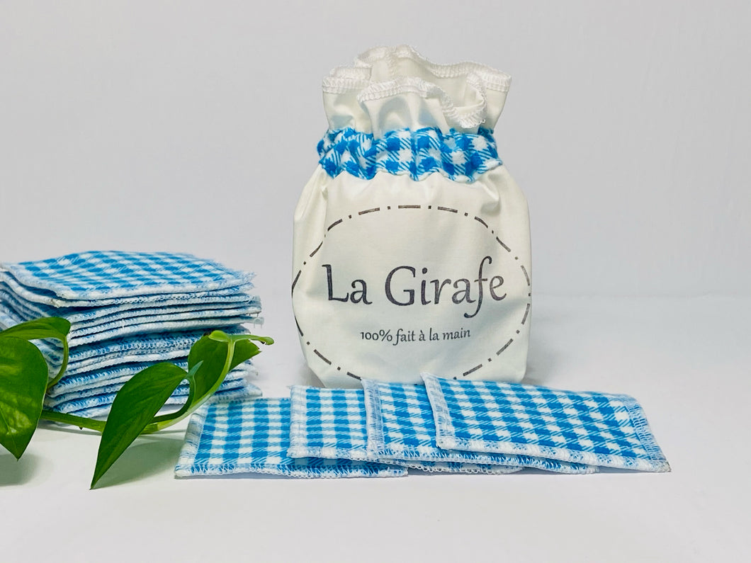 Ivory pouch printed with La Girafe Couture logo with a stack of Blue Checkered makeup remover pads