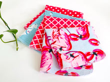 Load image into Gallery viewer, Four folded towels with Flamingo, Lamas and Polka Dots patterns in Pink and Blue
