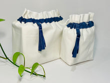 Load image into Gallery viewer, Two bags in off-white cotton with a Blue Denim trim. One bag is big and one small.
