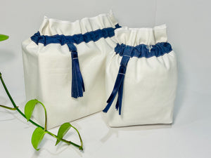 Two bags in off-white cotton with a Blue Denim trim. One bag is big and one small