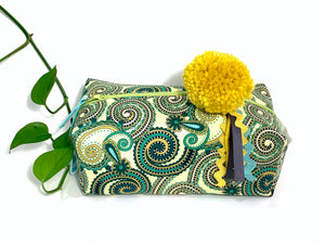 Side view of rectangular Cosmetic bag with Green Paisley printed pattern and Yellow Pompon