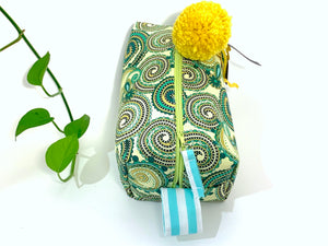 Top view rectangular Cosmetic bag with Green Paisley printed pattern and Yellow Pompon
