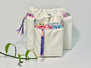 Two bags in off-white cotton with a Butterfly trim. One bag is big and one small