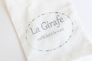 Closeup of La Girafe Logo on face mask pouch