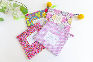 Four square bags with various patterns