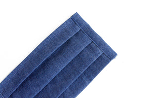 Close view of a face mask in Blue Denim fabric
