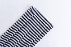 Closeup of a Face mask with Black and White stripes