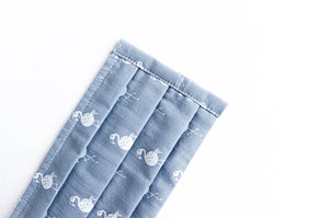 Closeup of face mask Grey with White Flamingo print