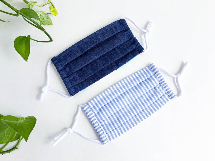 Two face mask, one in Blue Denim fabric, and one Blue and White Stripes