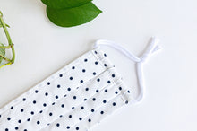 Load image into Gallery viewer, Closeup of a Face mask with Black Polka Dots on White ground

